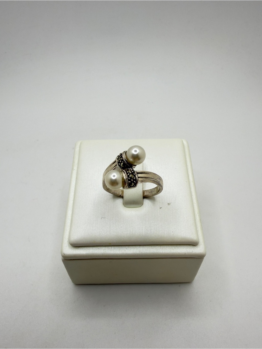 Sterling silver stamped, faux pearl and marcasite bypass ring!